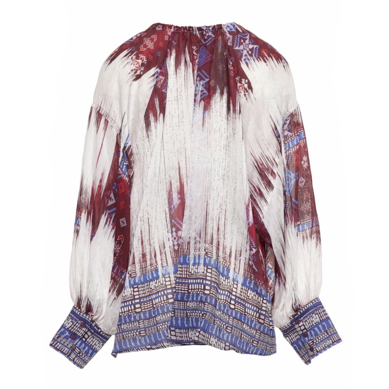 Detail of boho-style blouse with voluminous sleeves and ethnic-inspired print in warm tones