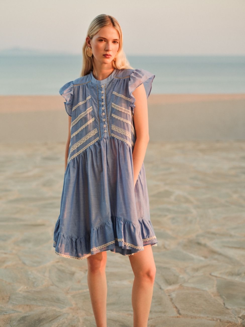 Devotion Twins Lull lace voile dress in soft blue with delicate lace inserts, ruffle sleeves and a light, airy silhouette for effortless summer styling.
