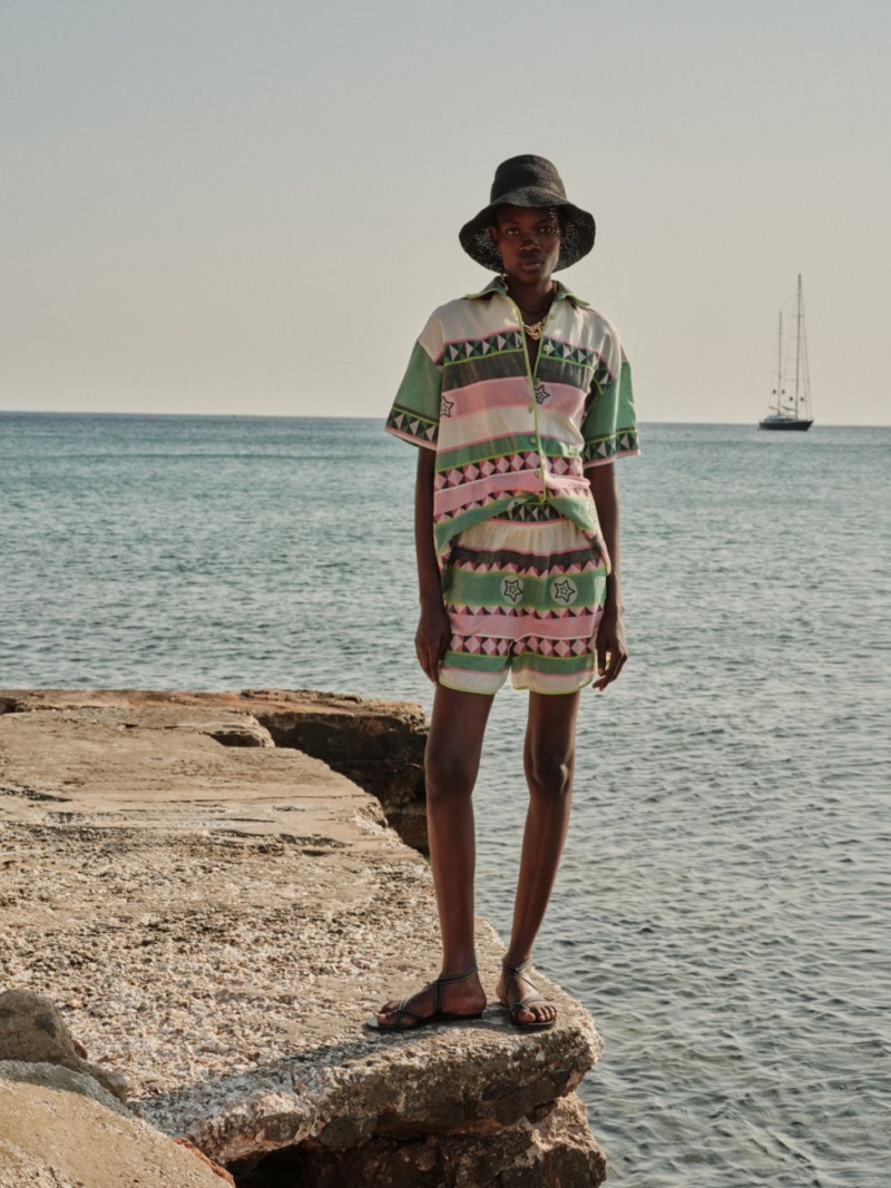 Short-sleeve printed shirt by Devotion Twins with a relaxed fit, button-front design, and striking geometric stripe pattern in soft summer tones.