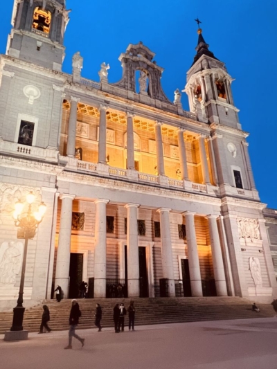 evening view of Madrid cathedral with warm lights and architectural details captured during Guanabana collection trip